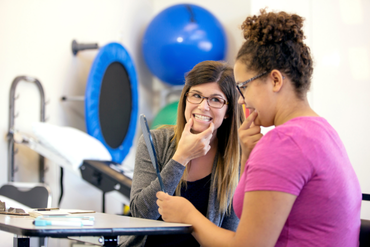 caregiver-helping-with-speech therapy speech therapy assistance