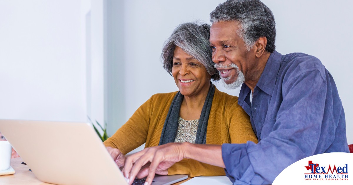A senior couple looks at a computer, representing older adults looking for payment options for home health care.
