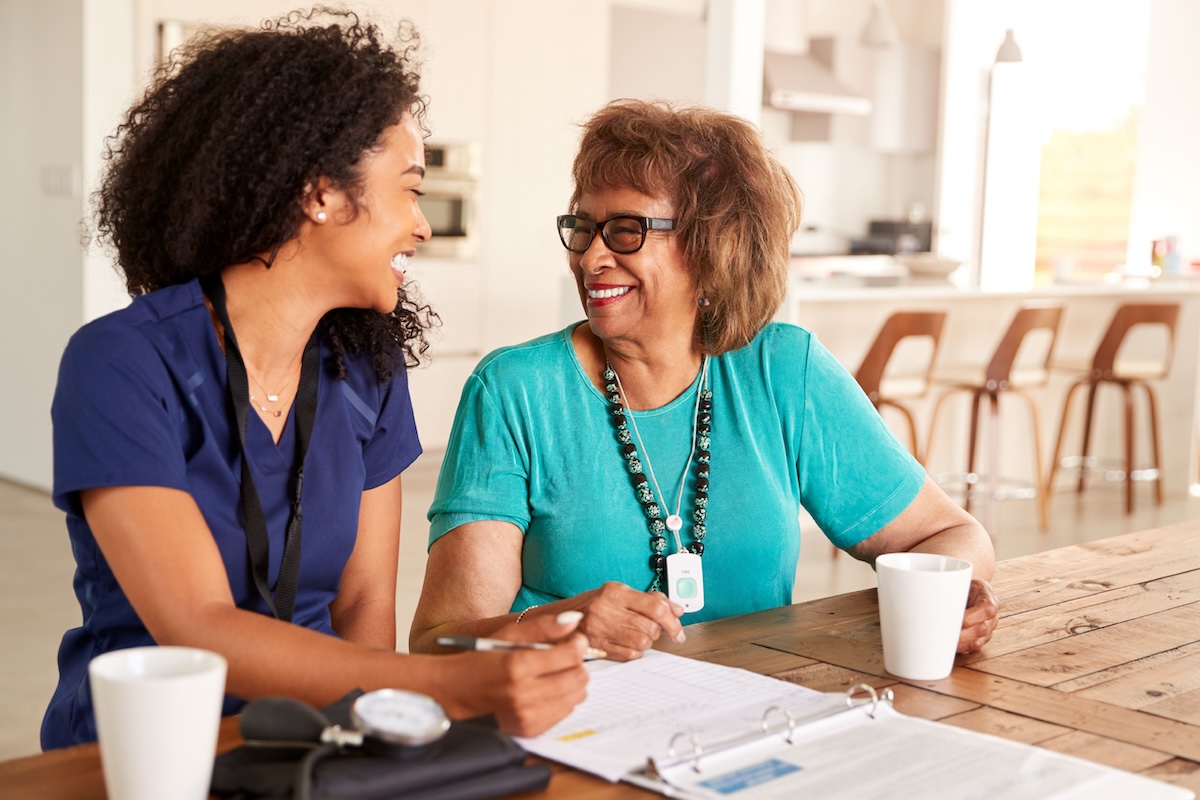 Skilled Nursing in Killeen A nurse talks to a client at home, representing quality skilled nursing in Killeen, TX.