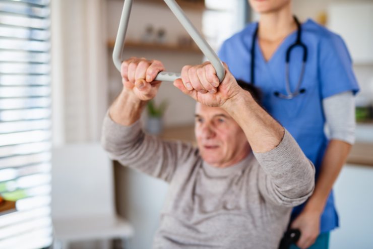 physical therapy in Copperas Cove, tx physical therapy in Copperas Cove, TX. A care giver assists an elderly man with psychical therapy as he is helped to stand up.