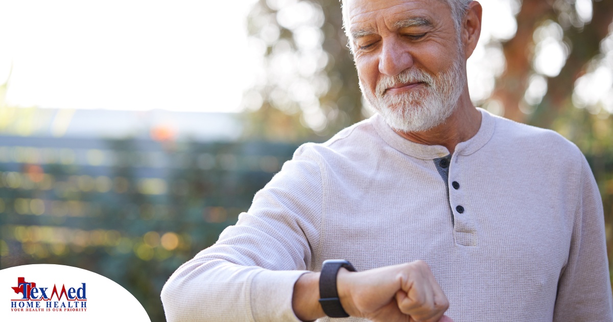 A senior man wears a smart watch, representing one of the many ways smart technology is shaping home health care.