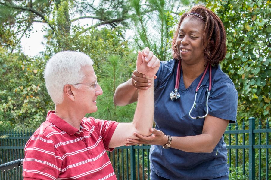 OccupationalTherapy1 A health care provider assists an elderly man with rehab an upper body injury by stabilizing his shoulder. Occupational Therapy in Copperas Cove