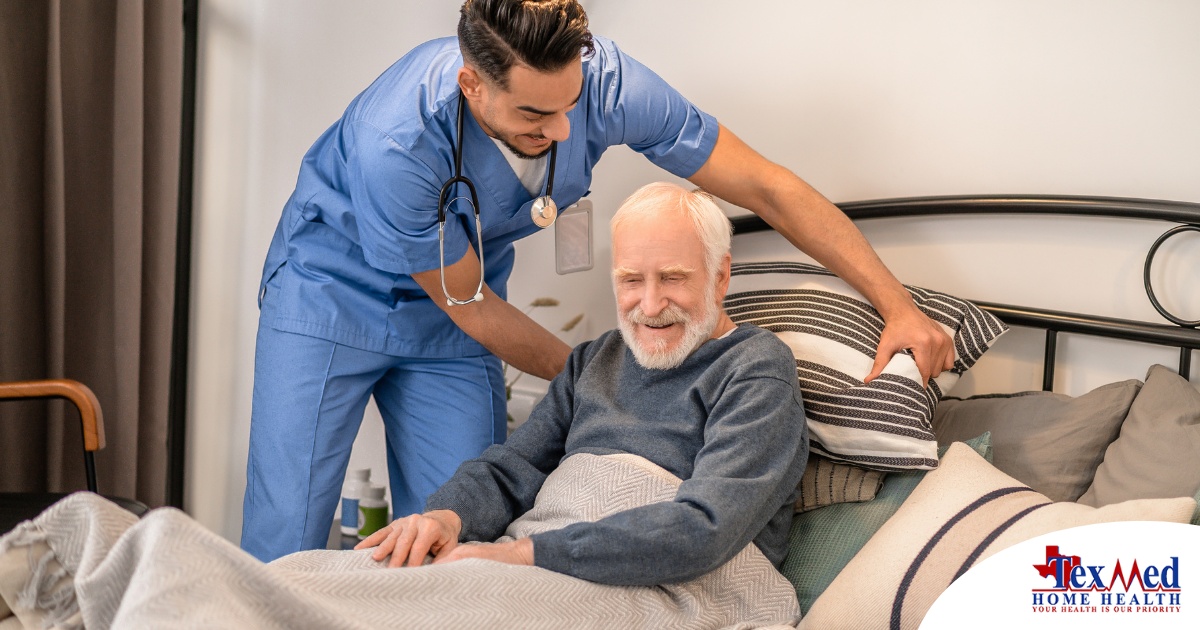 A home health care worker helps a patient in bed while both smile representing the results of a safe work habits.