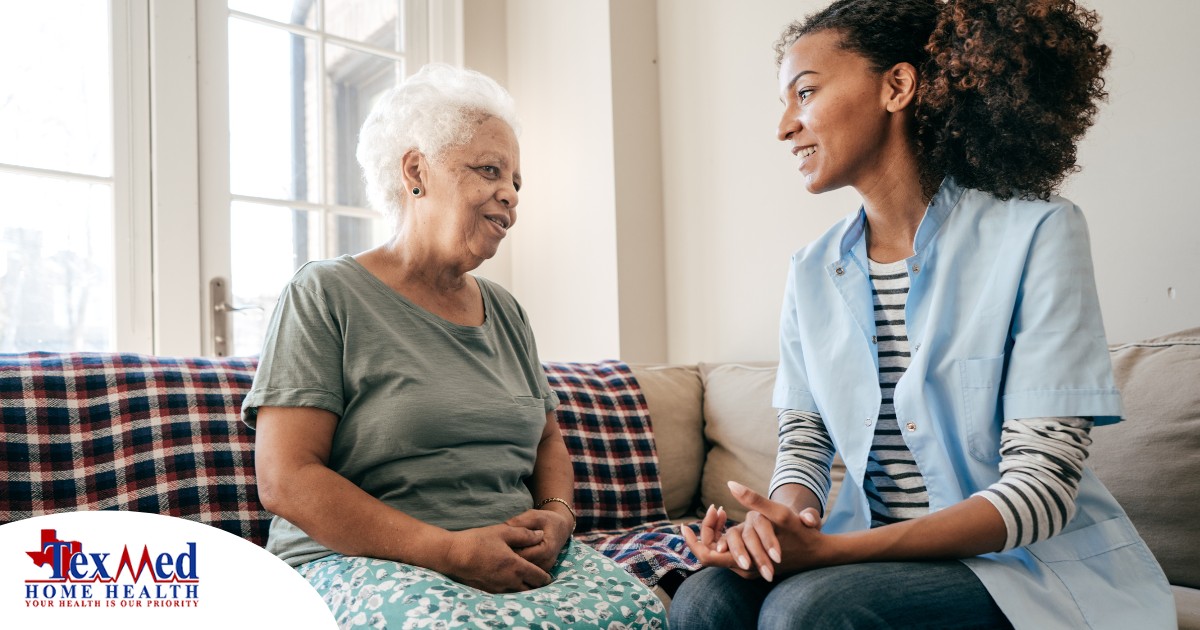 A caregiver sits and spends time with a client, representing how non-medical home care can benefit older loved ones.
