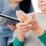 A caregiver providing in home care services to help manage a senior with arthritis