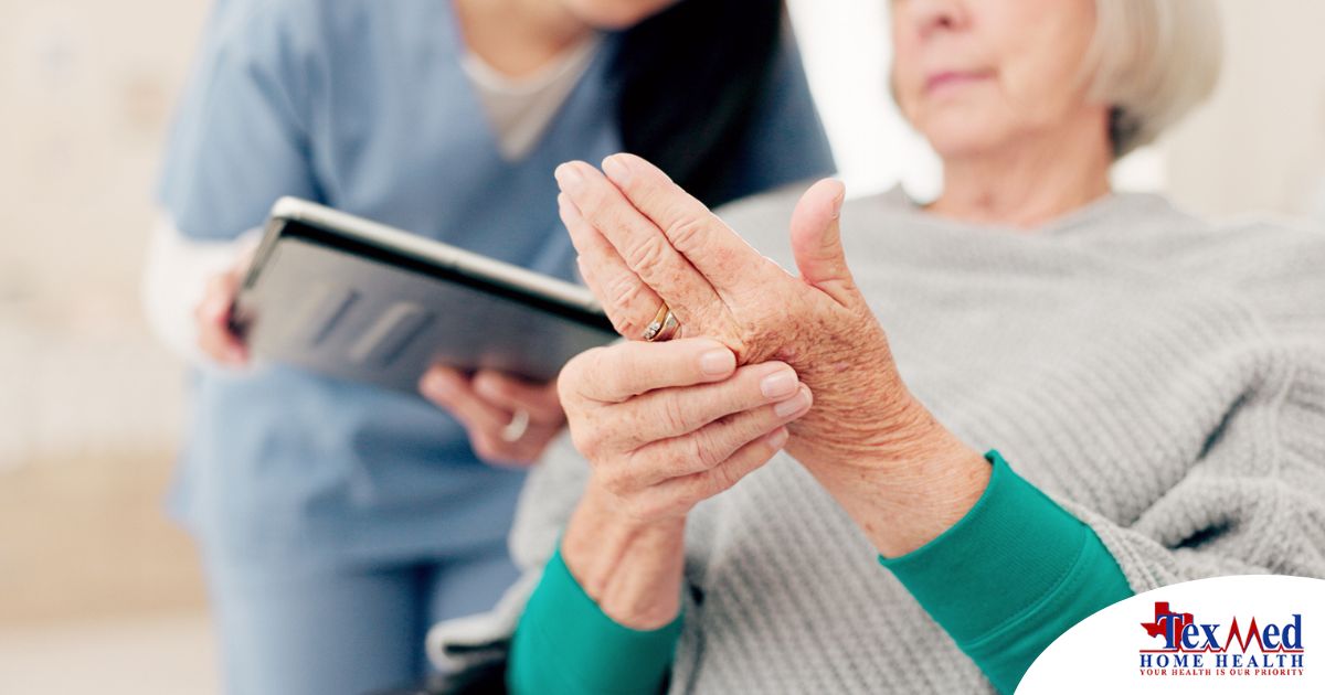 A caregiver providing in home care services to help manage a senior with arthritis