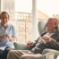 A caregiver provides Memory Care at Home to a senior